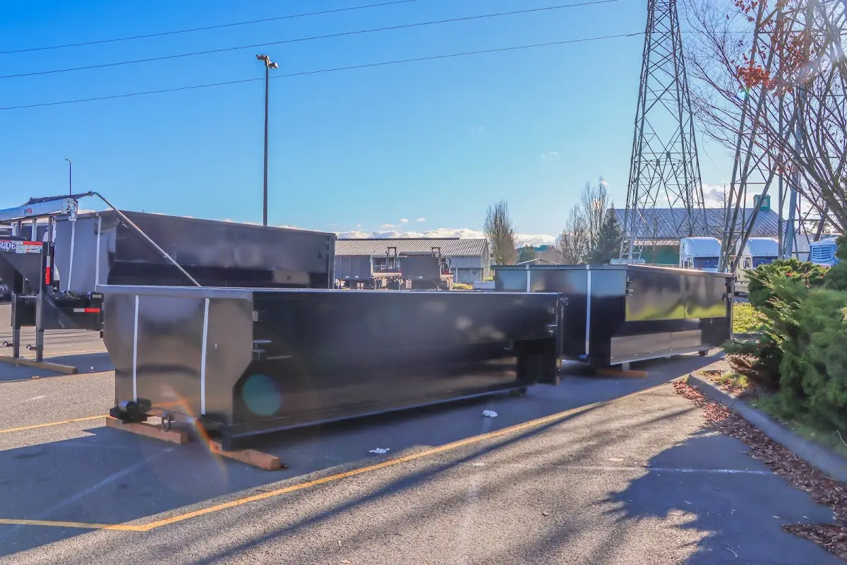 Roll-off dumpster ready for waste disposal at job site for Concrete Dumpster Rental in Manhattan